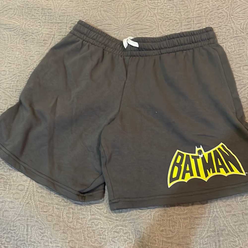Gray sweat shorts with Batman logo on leg